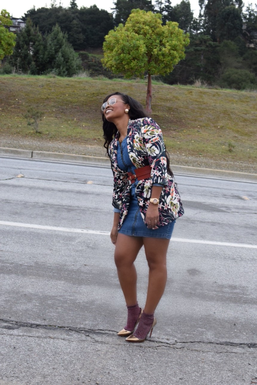 Denim dress, floral blazer covered with red belt, Bronze Christian Louboutin with red sparkle socks. side profile 