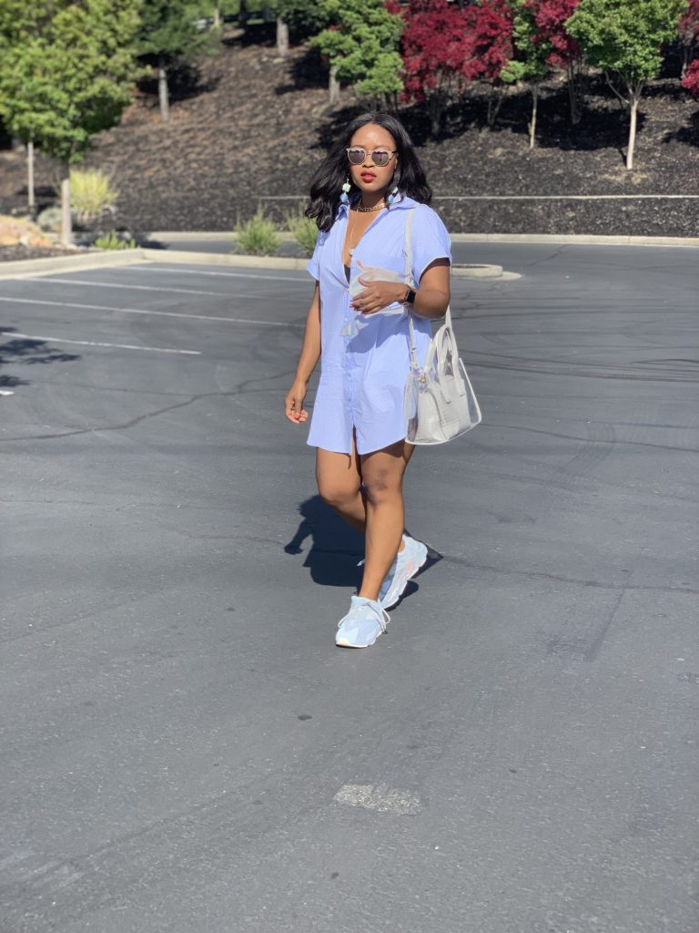 Blogger Steffanie Monae is wearing a white double breasted oversized zara blazer. It is paired with a Zara shirt dress and Adidas Yeezy Boost 700.