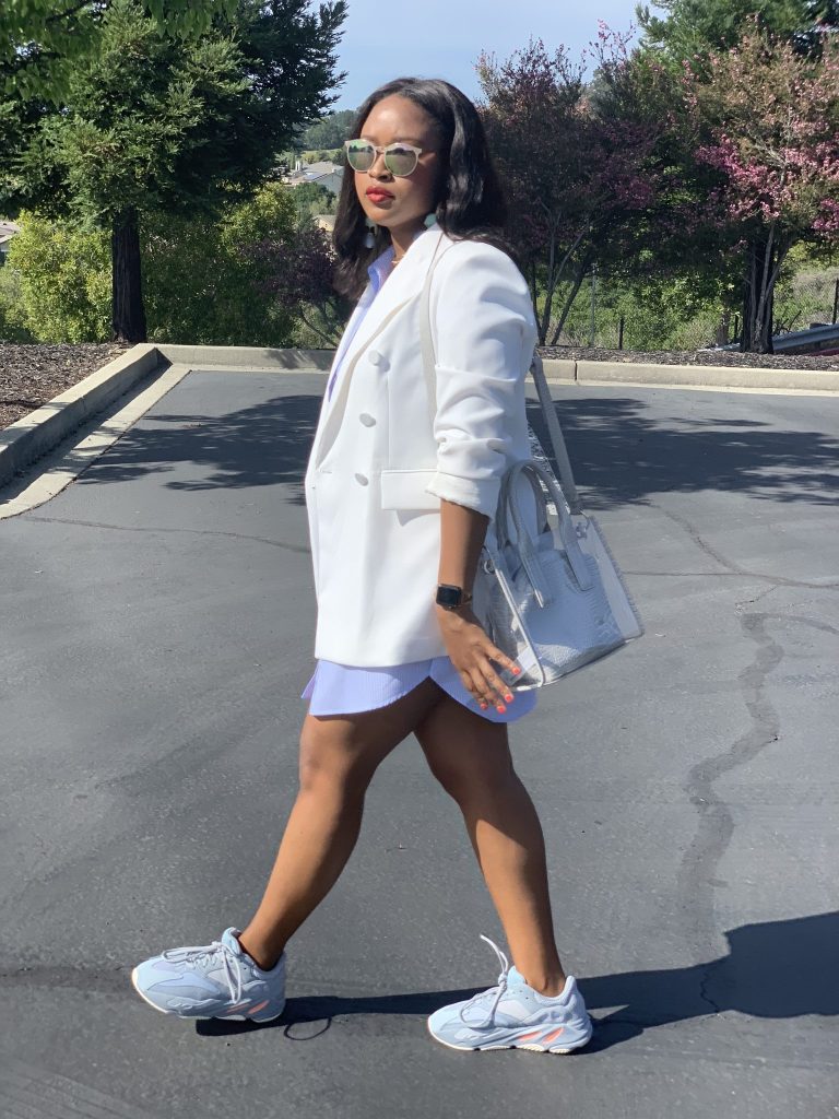 Blogger Steffanie Monae is wearing a white double breasted oversized zara blazer. It is paired with a Zara shirt dress and Adidas Yeezy Boost 700.