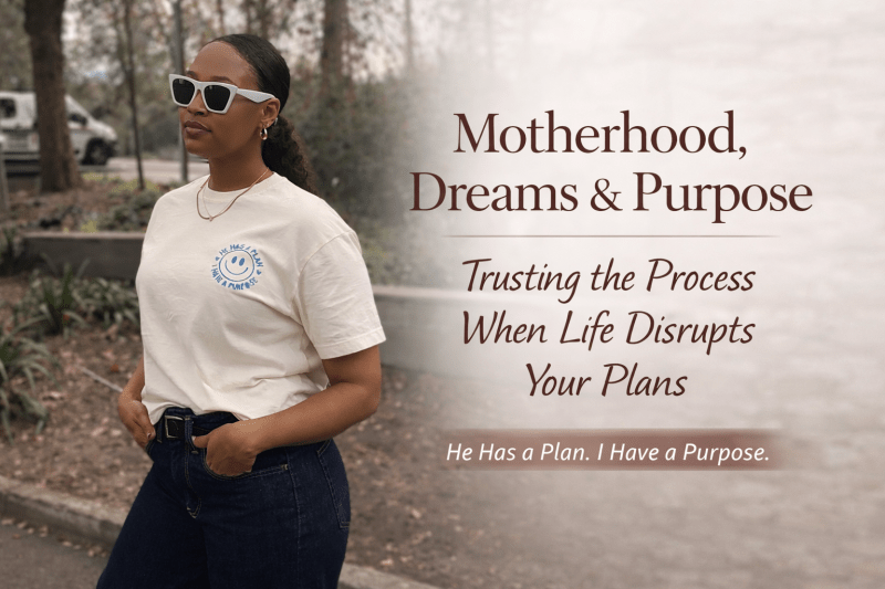Black woman wearing a cream “He Has a Plan. I Have a Purpose.” embroidered T-shirt standing outdoors, blog cover for “Motherhood, Dreams & Purpose: Trusting the Process When Life Disrupts Your Plans,” a faith-based article about motherhood, purpose, and trusting the process.